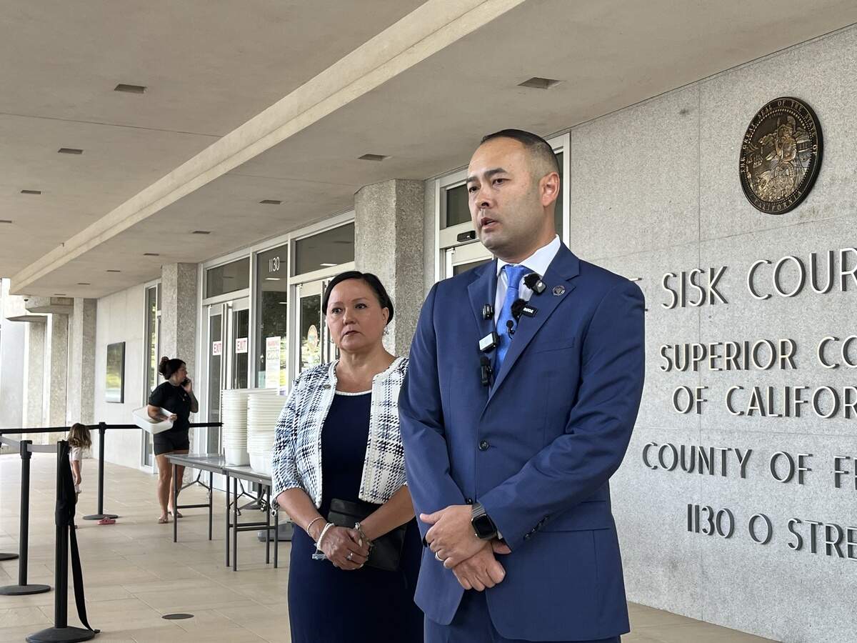Fresno City Attorney Andrew Janz, right, talks to the media on Aug. 24, 2026 at the B.F. Sisk Courthouse in downtown Fresno. Chief Assistant City Attorney Erica Camarena stood next to Janz.